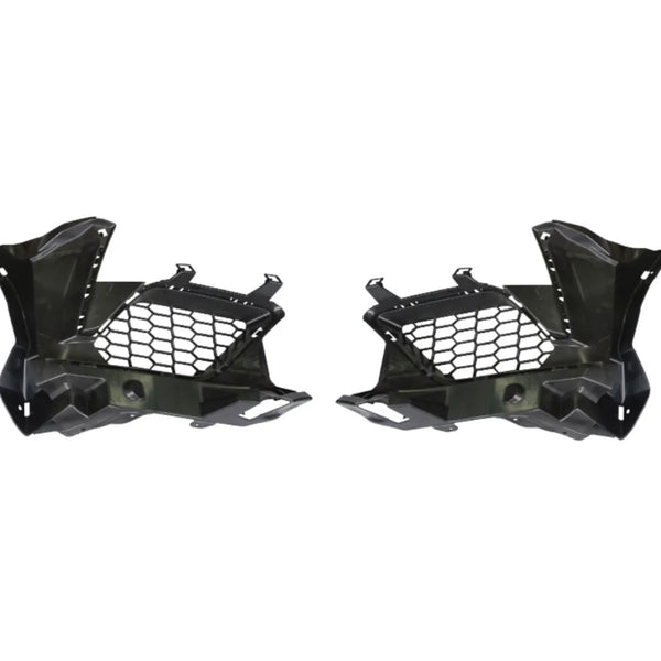 Two black plastic car components with honeycomb cutouts are symmetrically positioned. They have angular designs, suggesting automotive parts, likely for ventilation or structural support. Plain white background.