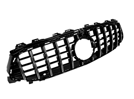 A black car grille with vertical chrome slats and a central circular emblem mount, set against a plain white background.