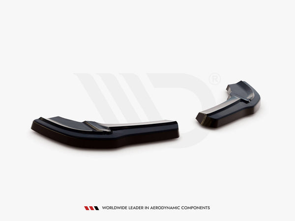 Black aerodynamic car components rest on a white surface in a studio setting. Text below reads: "WORLDWIDE LEADER IN AERODYNAMIC COMPONENTS."