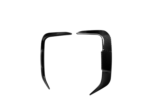 Two sleek black carbon fiber car trim pieces, facing each other symmetrically on a white background, likely designed for enhancing automotive aesthetics.