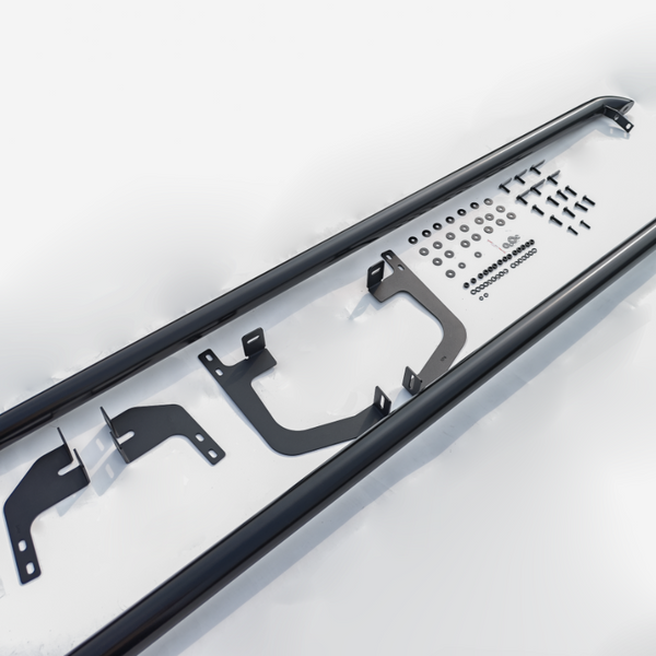 Metallic components are arranged neatly on a white surface. Two long black bars flank brackets and an assortment of bolts, nuts, and washers in organized rows.