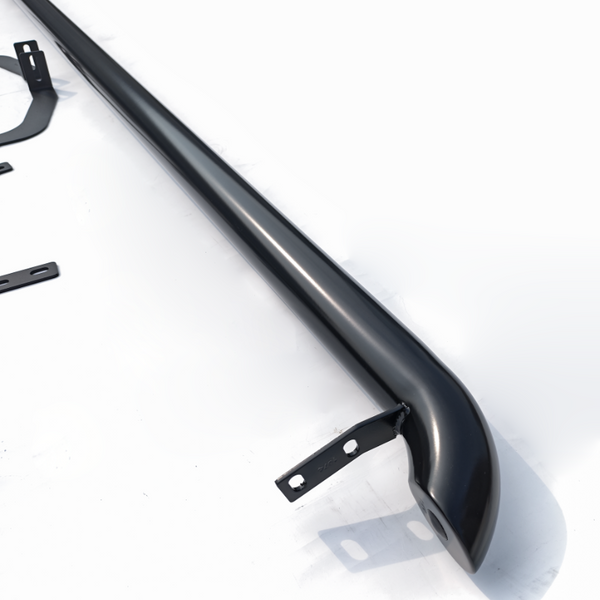 A sleek, black, curved metal bar with bracket mounts is positioned diagonally on a white surface. Additional small metal components are scattered nearby, suggesting assembly parts.