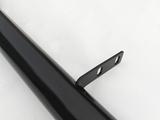 A black metal rod with a mounting bracket attached, featuring two holes for fastening. The object is positioned against a plain, light background.
