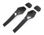 Two sleek, black carbon fiber car trim pieces are positioned on a plain white background. Above them, two smaller matching components are aligned, showcasing an elegant design.