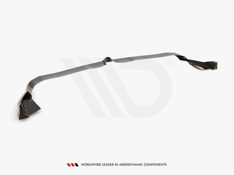A dark, elongated car spoiler rests on a plain white background. It features angular end sections. Text reads: "WORLDWIDE LEADER IN AERODYNAMIC COMPONENTS" below the spoiler.