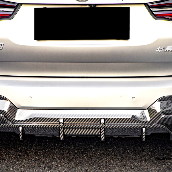 A silver car's rear with red taillights and a carbon-fiber diffuser is parked on a street. Text visible: "iX3" and Chinese characters on the back.