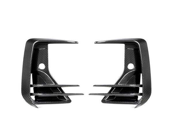 Two carbon fiber air vents, mirror each other, featuring three horizontal slats and a rounded hole in the center against a white background.