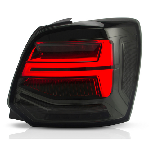 A rectangular car tail light with illuminated red sections is positioned against a white background, highlighting its sleek, modern design and layered contours.
