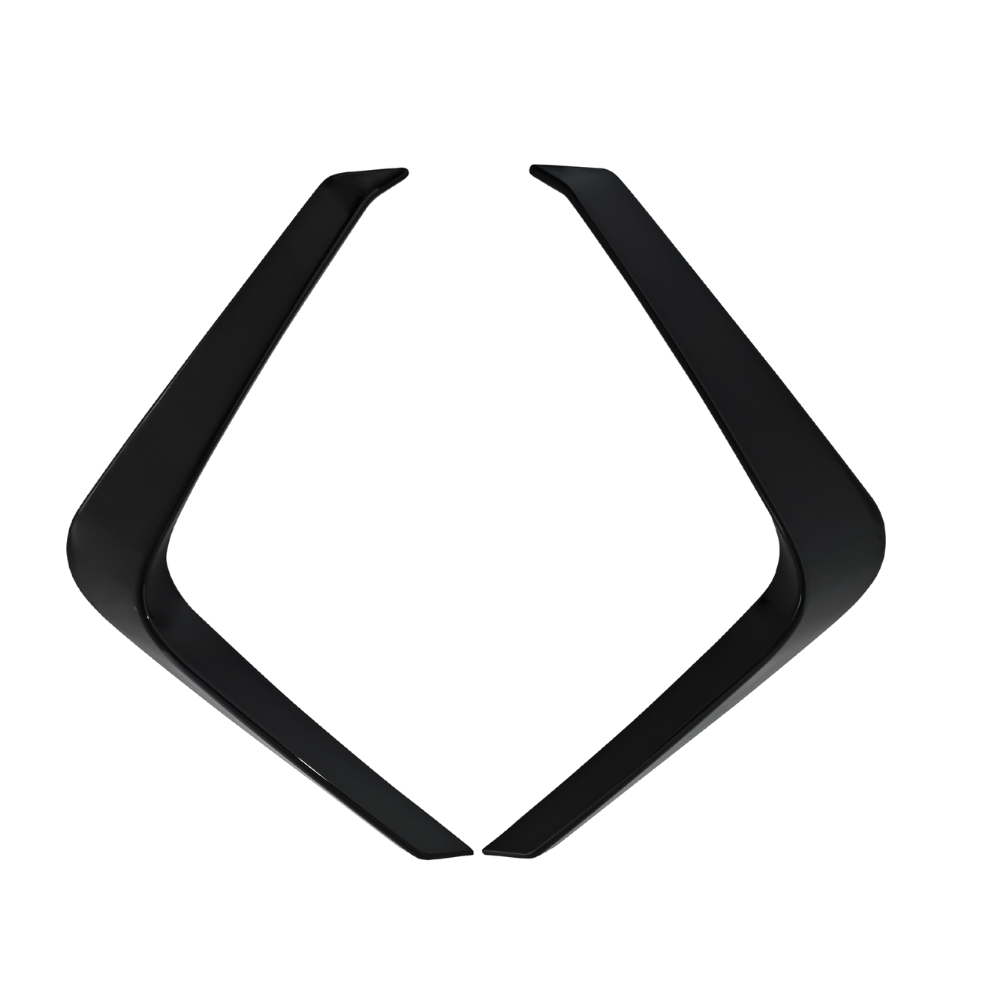 Two black, angular objects face each other, their pointed ends slightly apart, forming a symmetrical, open chevron shape against a plain white background.