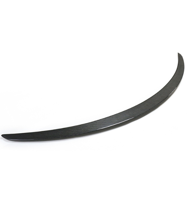 A sleek, black, curved car spoiler rests on a plain white background, highlighting its streamlined design and subtle texture.