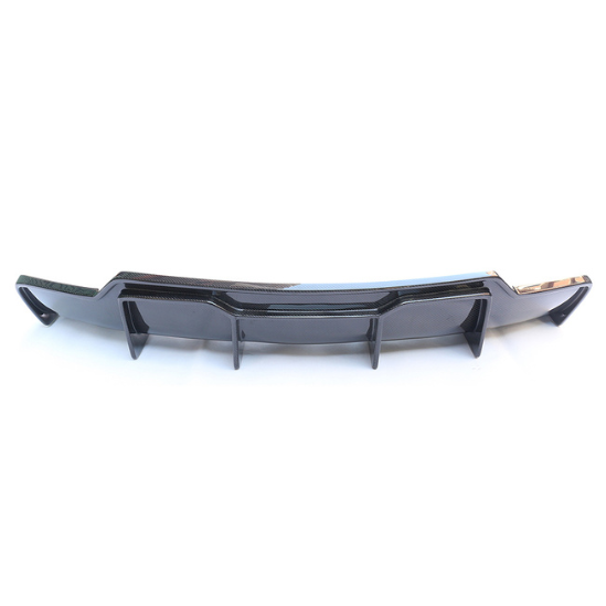 A black car diffuser with vertical fins rests on a plain white background, designed for enhancing aerodynamic performance and visual aesthetics.