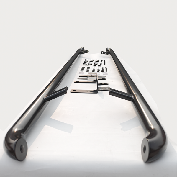 Two black metal bars lie parallel on a white surface, surrounded by various mounting brackets and screws arranged systematically, suggesting an assembly kit.