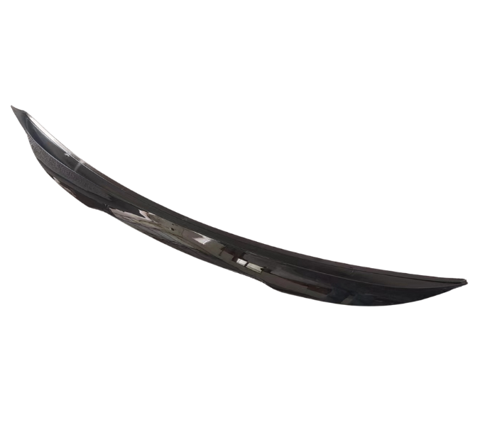 A sleek, black car spoiler rests against a plain white background, showcasing its curved design and glossy finish.