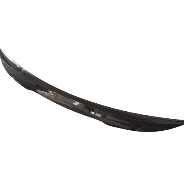 A sleek, black car spoiler rests against a plain white background, showcasing its curved design and glossy finish.
