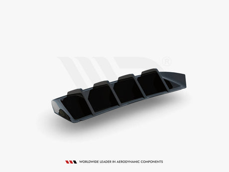 A black, angular aerodynamic component with four vertical fins, resting on a white surface. Text below reads: "WORLDWIDE LEADER IN AERODYNAMIC COMPONENTS."