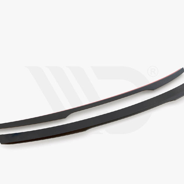 Two sleek, curved black car spoilers placed parallel on a plain white background. Text below reads: "Worldwide Leader in Aerodynamic Components."