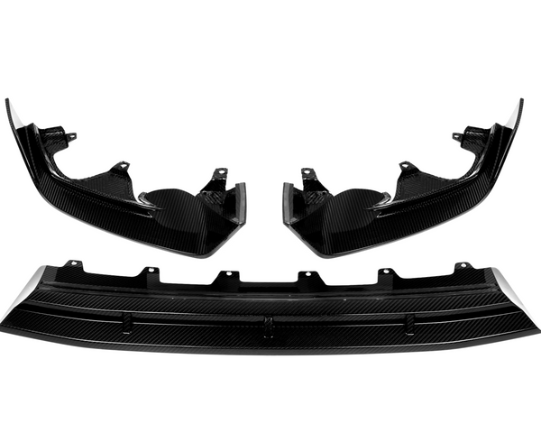 Carbon fiber car parts, including two curved side panels and a central diffuser, displayed against a white background. The pieces have a glossy finish and intricate texture.