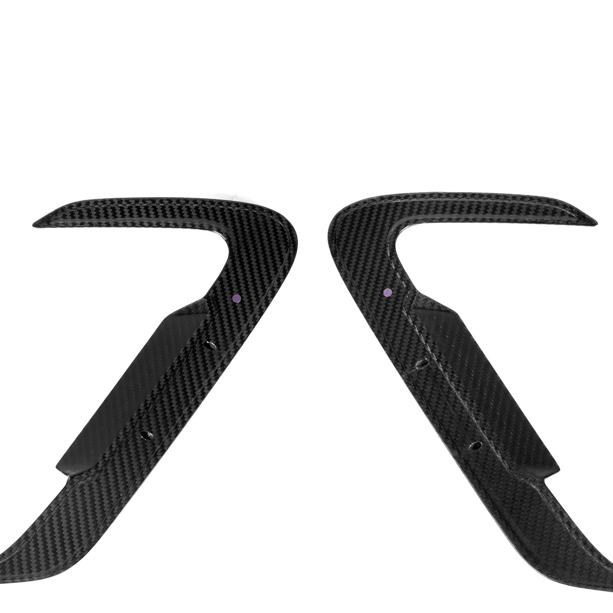 Two curved, black carbon fiber car parts with pointed ends face each other symmetrically on a plain white background, displaying polished surfaces and small holes near the center.