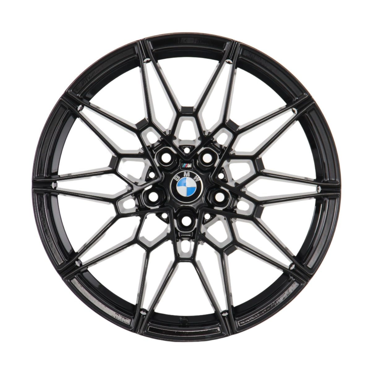 A black, intricately designed alloy wheel rim with the BMW logo at its center, viewed directly from the front, set against a plain white background.