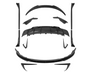 Carbon fiber car body kit parts, precisely arranged, suggesting assembly. Components include a diffuser, spoilers, side skirts, and splitters, placed on a plain white background.