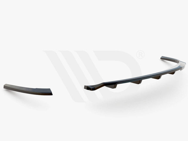 A three-piece black aerodynamic car component lies on a plain white background. Text below reads "WORLDWIDE LEADER IN AERODYNAMIC COMPONENTS."