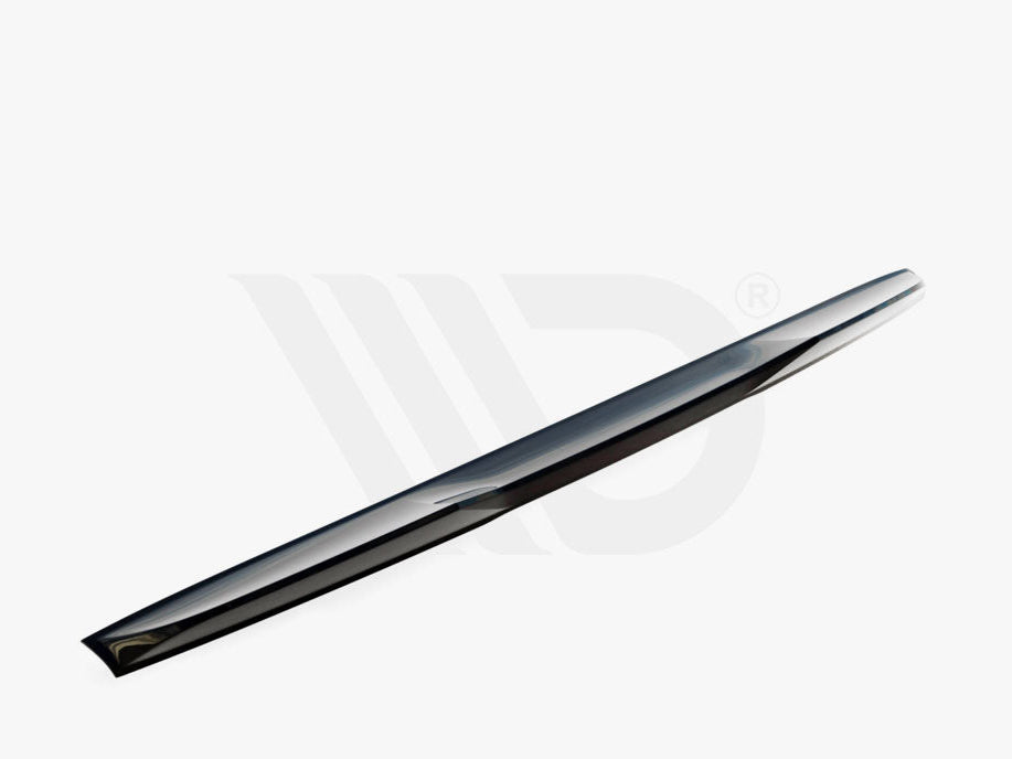 A sleek, elongated car spoiler lies diagonally on a plain white background. Text below reads: "WORLDWIDE LEADER IN AERODYNAMIC COMPONENTS."