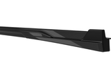 A sleek, black, elongated vehicle side skirt with angular design details, positioned against a plain white background.