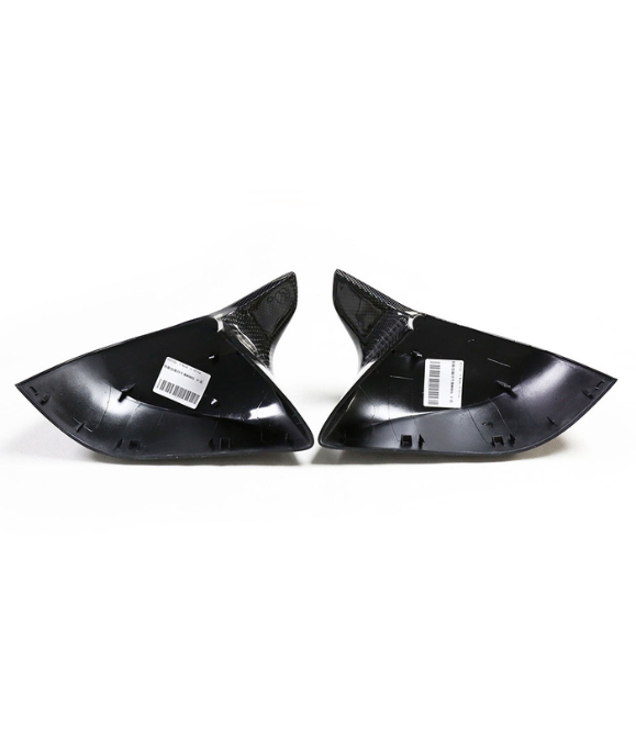 Two glossy black triangular panels with textured ends rest on a white surface, each labeled with a barcode sticker.