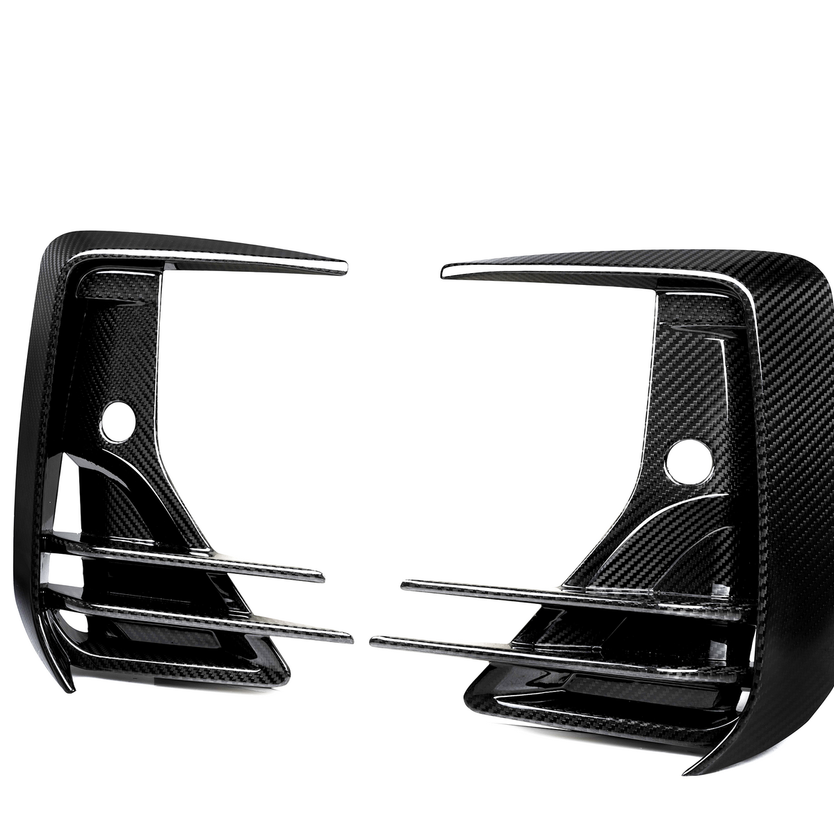 Two carbon fiber car rear diffuser fins with horizontal slats are positioned symmetrically facing each other against a white background, showcasing their sleek, aerodynamic design.