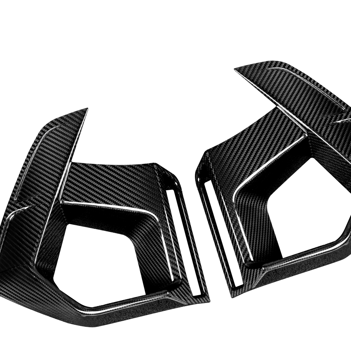 Two black carbon fiber car parts, shaped with angular edges, rest against a white background. They appear to be side mirrors or aerodynamic components.