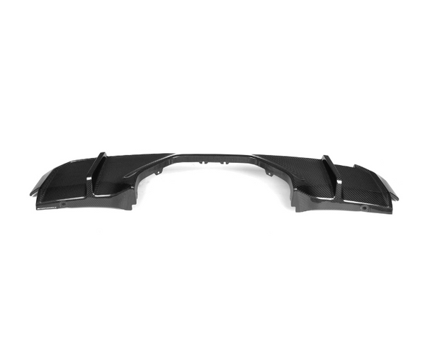 Carbon fiber car diffuser with angular fins, resting on a white background, designed to enhance aerodynamics and style.
