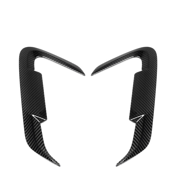 Two carbon fiber car trim accents, symmetrically placed and curving inward, on a plain white background. They feature a sleek, aerodynamic design with a glossy texture.
