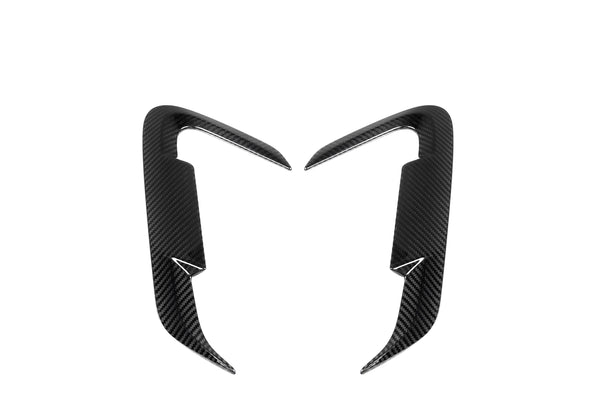 Two carbon fiber car trim accents, symmetrically placed and curving inward, on a plain white background. They feature a sleek, aerodynamic design with a glossy texture.