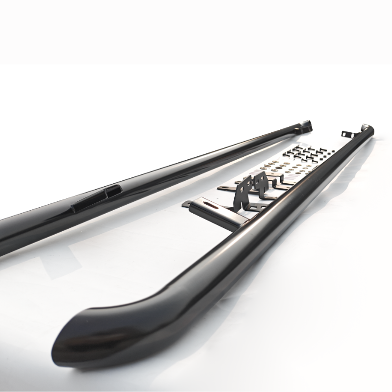 Two black metal side steps lay on a white surface, accompanied by multiple small brackets and hardware pieces, arranged neatly between the steps. They are designed for vehicle installation.