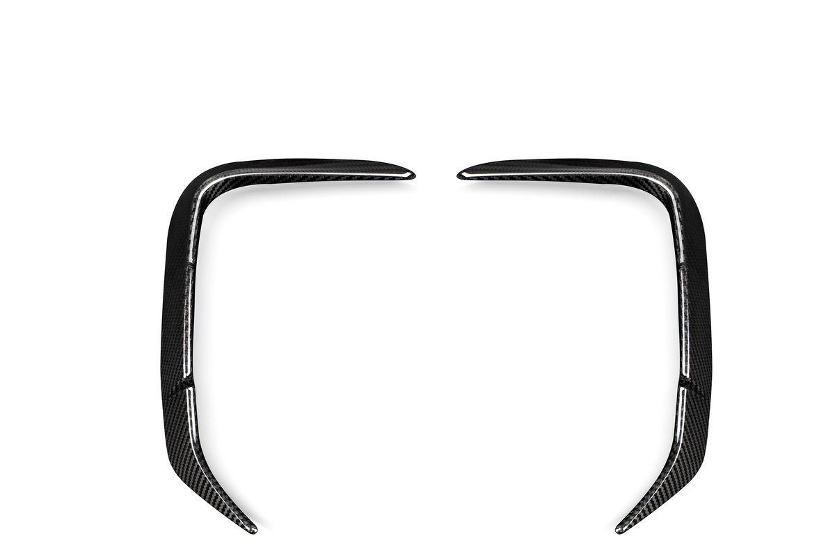 Two carbon fiber, L-shaped car trim pieces are arranged symmetrically, facing each other, against a plain white background.