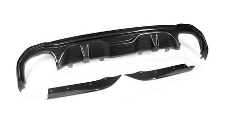 Carbon fiber car diffuser, disassembled, resting on a white background. Two smaller side pieces complement the main central component, showcasing a sleek, aerodynamic design with a shiny finish.