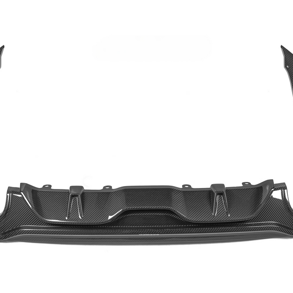 Carbon fiber car body kit components, including a rear diffuser and side wings, laid out on a white background for display.