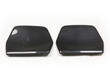 Two carbon fiber car mirror covers, arranged side by side on a plain white background, displaying a sleek, glossy surface with a distinctive woven pattern.