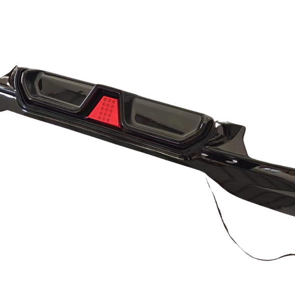 A black car bumper with built-in red brake lights, designed to fit at the rear of a vehicle; it lies on a plain white background with an attached cable.