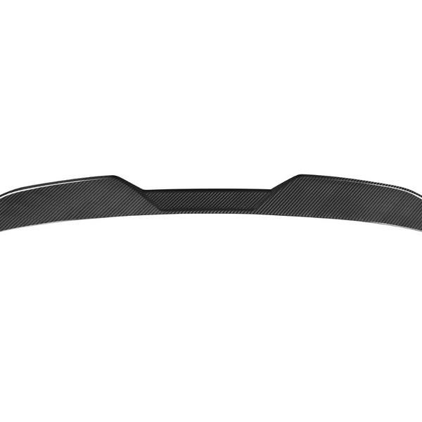 Carbon fiber car spoiler sits against a plain white background, showcasing its aerodynamic, sleek structure with upward-curving edges and textured pattern.
