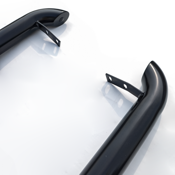 Two black, curved metal bars with mounting brackets are positioned on a white surface, appearing ready for installation or attachment in an industrial or automotive context.