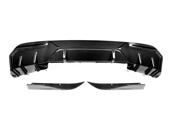 A carbon fiber car rear diffuser with aerodynamic fins is positioned against a plain white background, highlighting its sleek, black contoured surface and modern design elements.