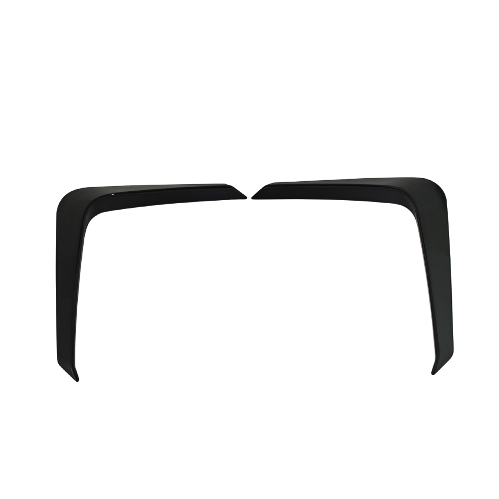 Two black, angular objects with sleek edges, positioned symmetrically against a plain white background, resembling modern automotive or architectural components.