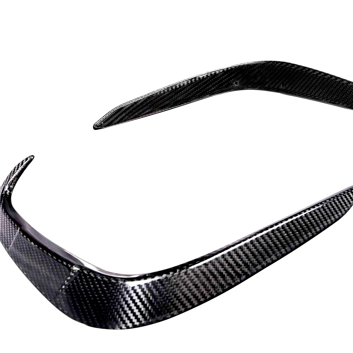 Carbon fiber car bumper parts, one with a curved edge and another elongated piece, are positioned against a plain white background, showcasing their sleek design and texture.