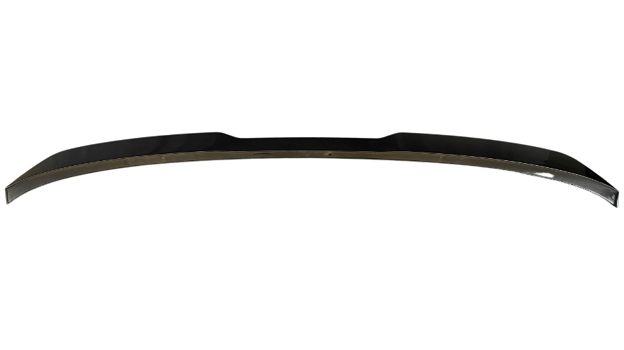 A black, curved car spoiler lies flat against a plain white background, showcasing its sleek aerodynamic design and glossy finish.