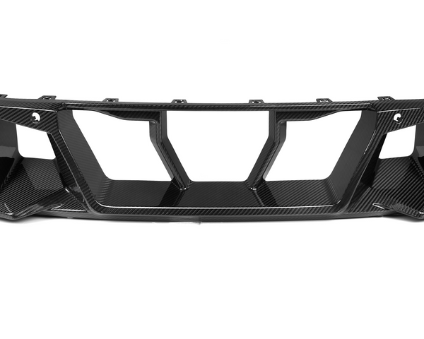 A carbon fiber car diffuser with angular vents is positioned on a white background, emphasizing its sleek, aerodynamic design intended for enhanced vehicular performance and aesthetic.