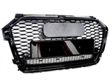 A black honeycomb car grille with a rectangular emblem and license plate holder, set against a plain white background.