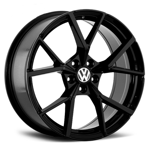 A black alloy wheel with a glossy finish prominently displays the Volkswagen logo at its center; it has five large, split spokes, viewed against a plain white background.