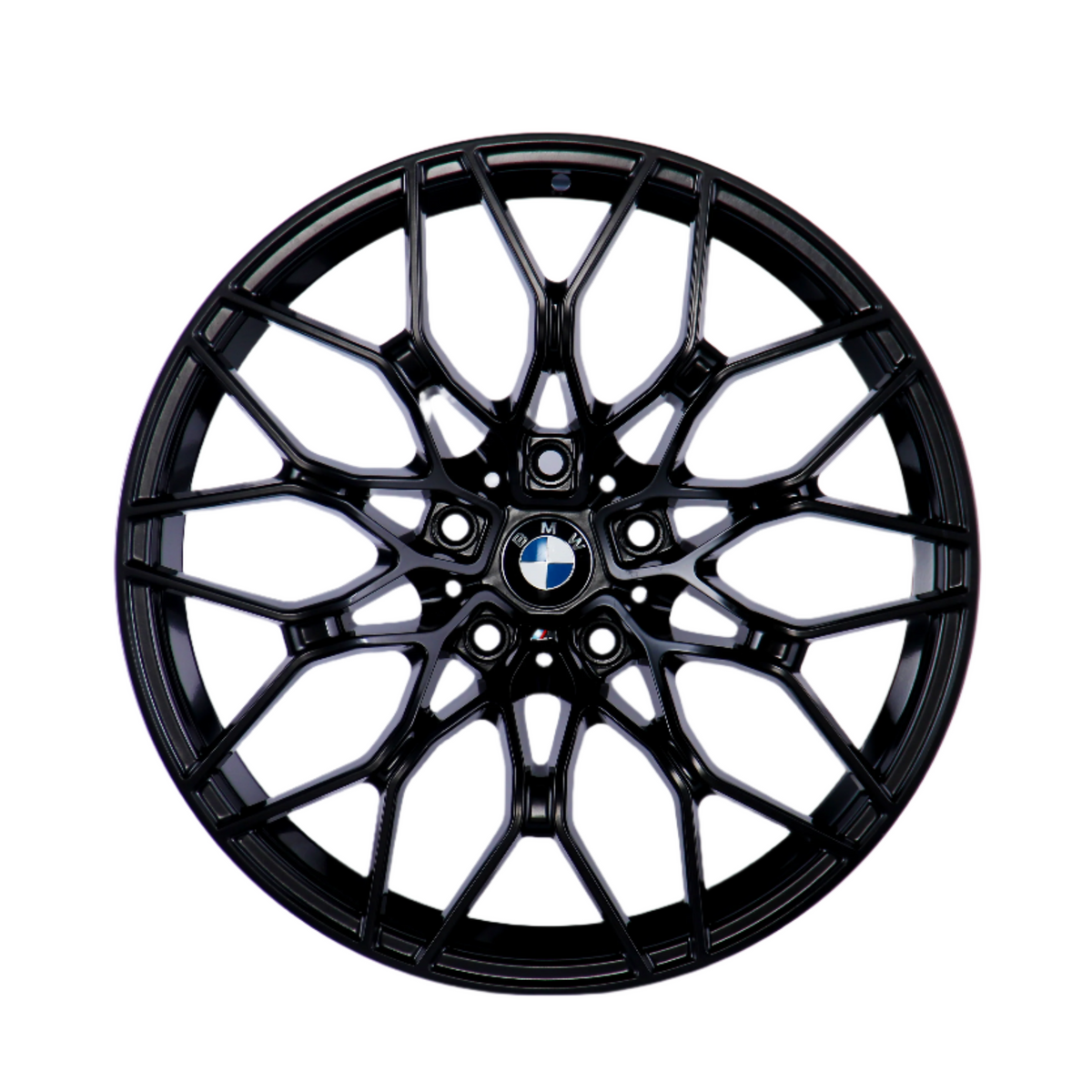 A black, multi-spoke alloy wheel with a central BMW logo, displayed against a plain white background, showcasing intricate design and structure.