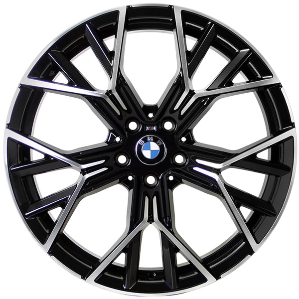 A metallic, multi-spoke alloy wheel with BMW logo at the center, designed for vehicles, displayed against a white background. The spokes feature a black and silver finish with intricate angles.